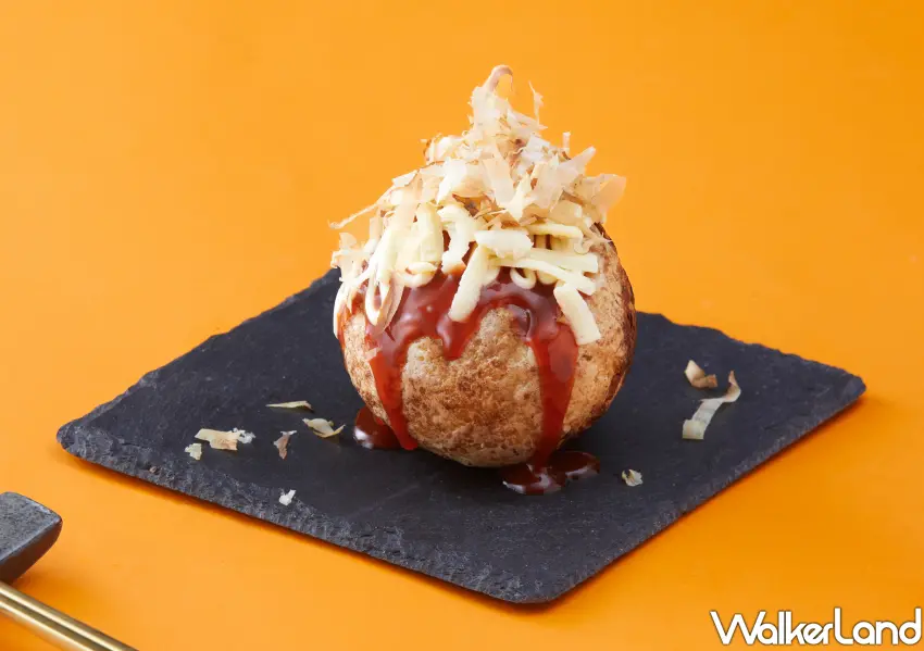 ▲爆彈燒本舖巨大章魚燒內部則包覆章魚，蛤蜊，玉米，鵪鶉蛋等多種食材，吃起來層次豐富且口感厚實。