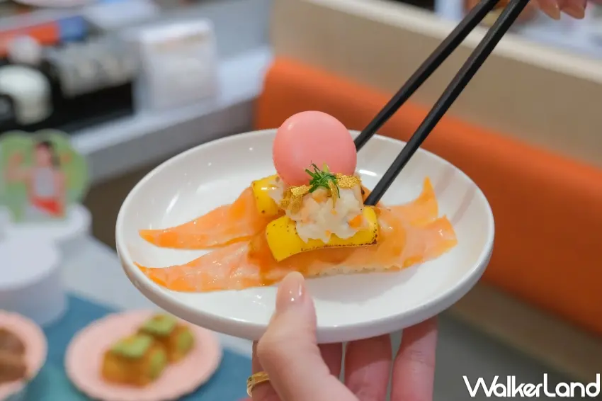 ▲爭鮮以甜心馬卡龍炙鮭、開心果泡芙打造鹹甜交織新吃法。（攝影：張人尹）