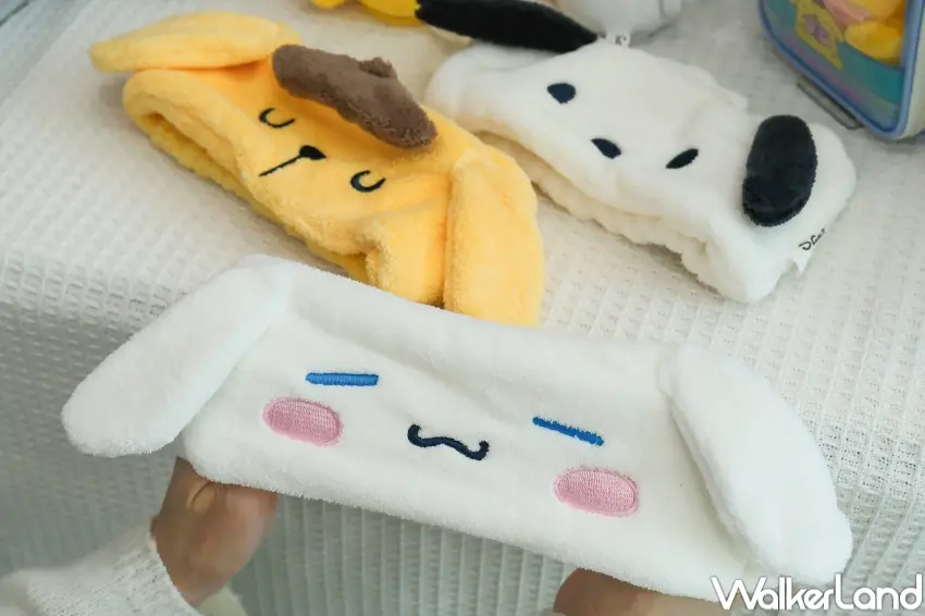 ▲7-11推出三麗鷗居家療癒周邊,包括立體造型浴巾與絨毛造型吸水髮帶,讓粉絲在家也能和布丁狗、大耳狗喜拿、帕恰狗一起賣萌。(攝影:張人尹)