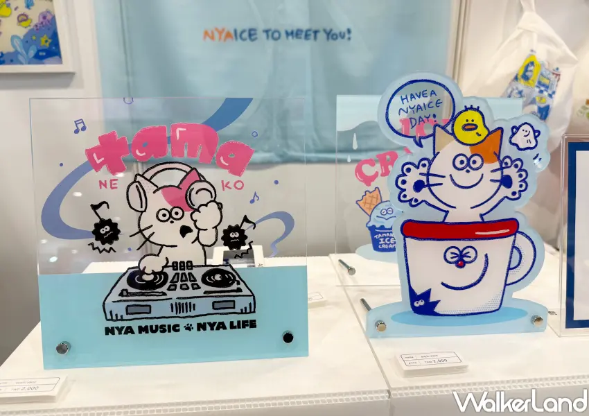 ▲2026台灣禮品文具展必逛日本館！Tama 貓貓壓克力立牌、Tama貓貓角色貼紙、明信片、吊飾等周邊。(攝影：鄭亦庭)