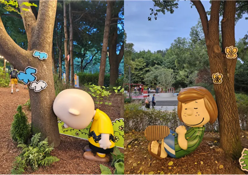 ▲花生漫畫角色們在林間露營休閒，逗趣可愛的身影令人忍不住駐足拍照。