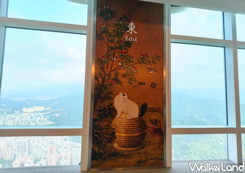 ▲觀景台貓咪戲球打卡區翻玩故宮走獸與風阻尼球意象,將傳統畫作與台北101防震守護意象相結合,打造可愛的雲端打卡牆。(攝影:鄭雅之)